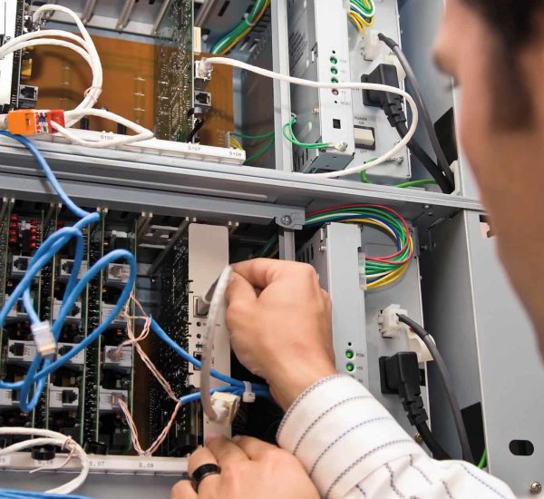 Data cabling calgary – it guy checking network cables Data cabling calgary - network cables