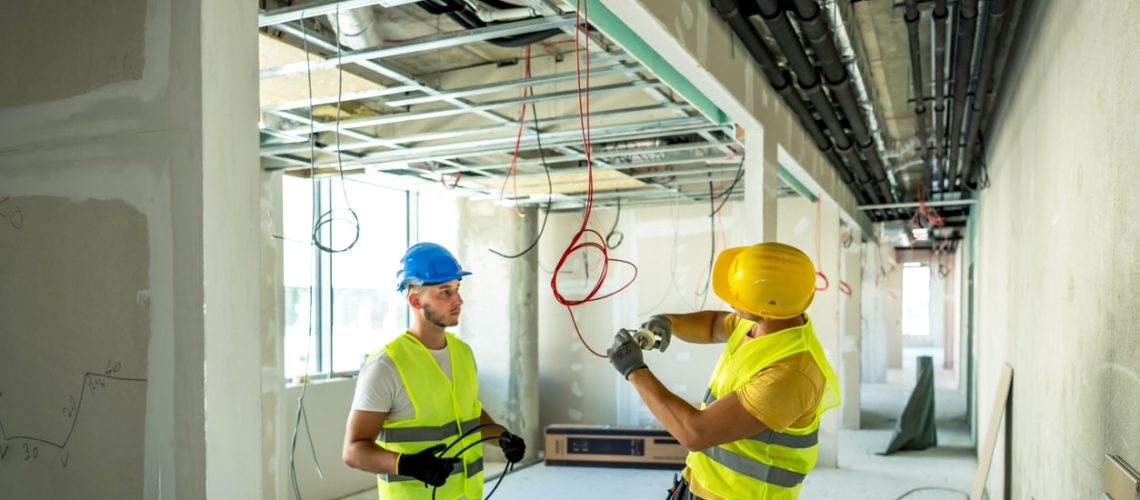 Electrician making wiring at new house